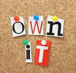 bulletin board spells the phrase own it